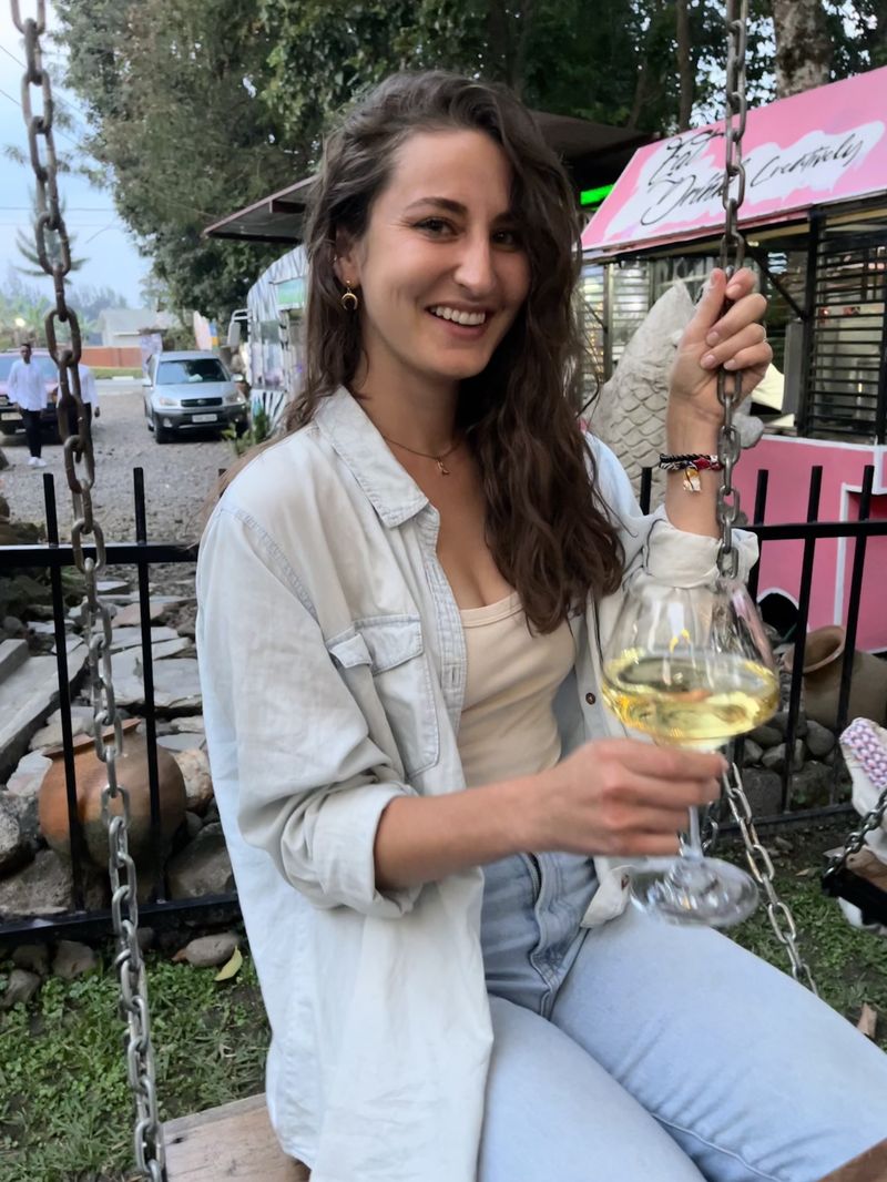 Sabrina with a glass of wine